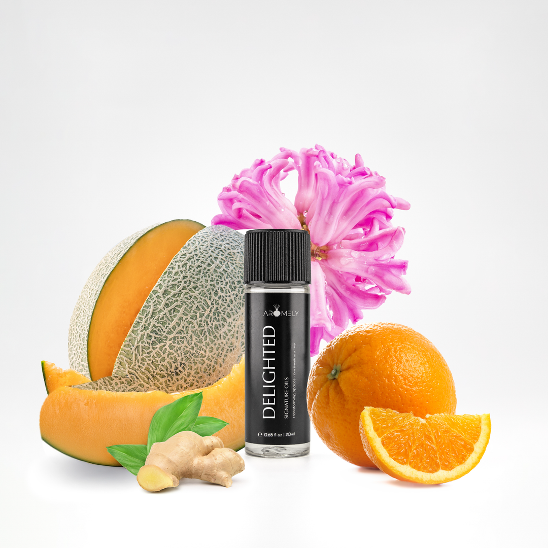 Aromely Delighted essential oil blend, 20ml bottle, infused with melon, ginger, bright orange citrus, and pink florals. A sweet, spicy, and citrusy scent for cheerful spaces, bringing the vibrant energy of a high-end resort to your home.