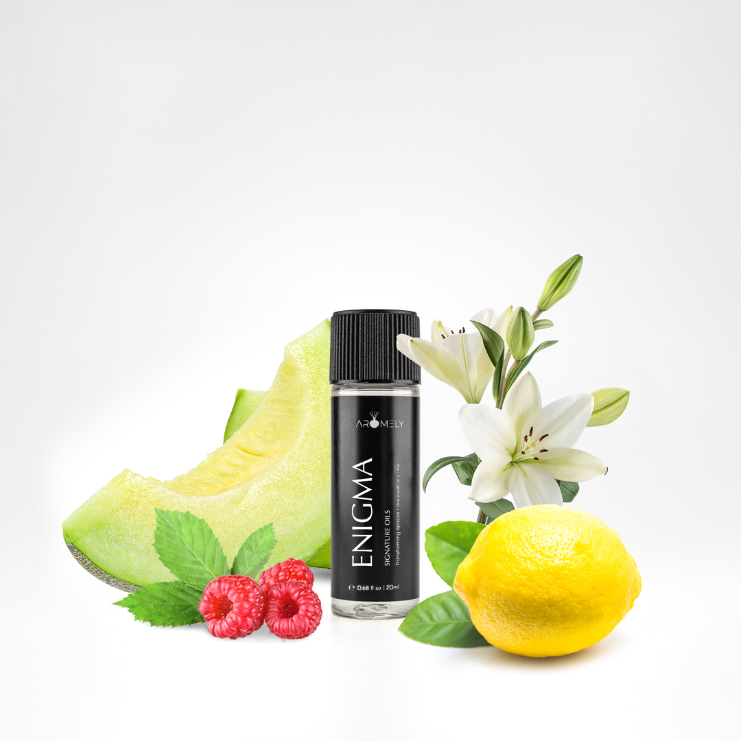 Aromely Enigma essential oil blend, 20ml bottle, featuring honeydew melon, raspberries, lemon, and white lilies. A fruity, citrusy, and floral blend that fills your space with mystery and freshness—just like a boutique hotel.