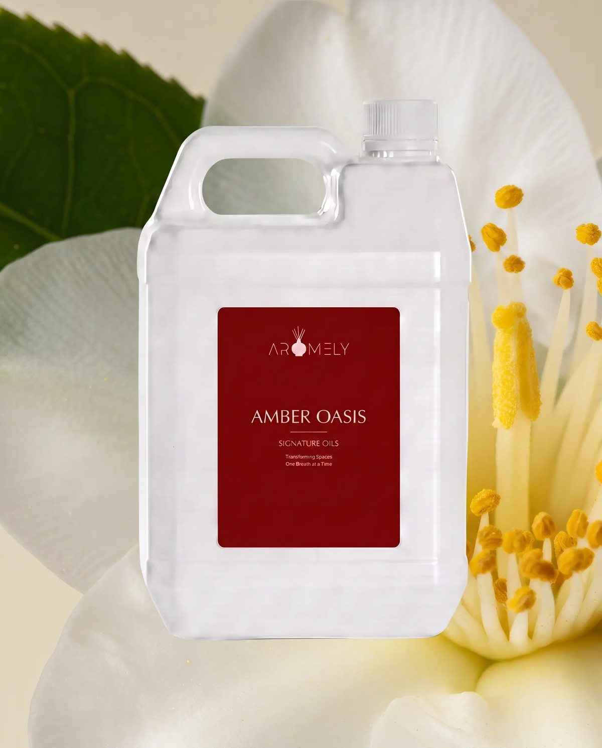 Aromely Amber Oasis fragrance oil bottle, 1 Gallon, against white petals