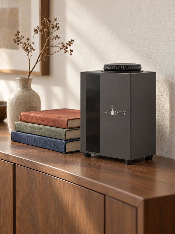 ARO HOME scent diffuser on a wooden sideboard with books in a sunlit living room