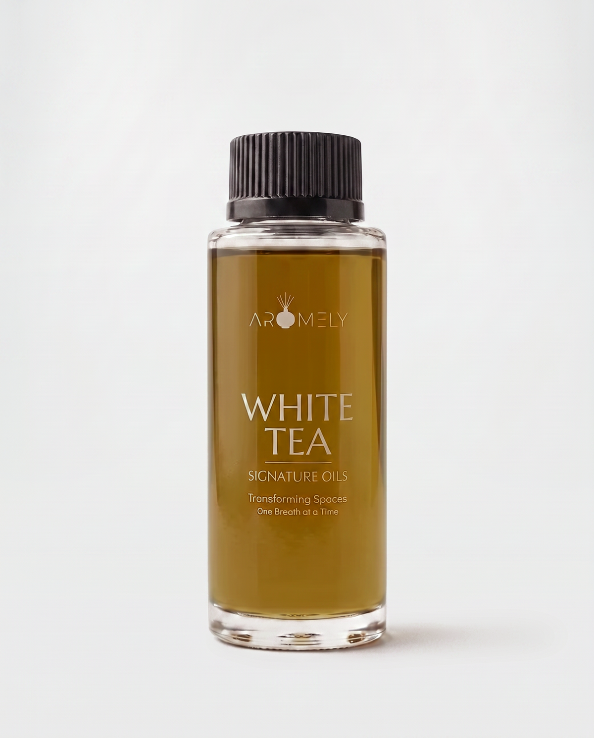 A clear glass bottle of Aromely White Tea Signature Oils containing amber-colored oil, topped with a black ribbed cap, set against a clean white background.