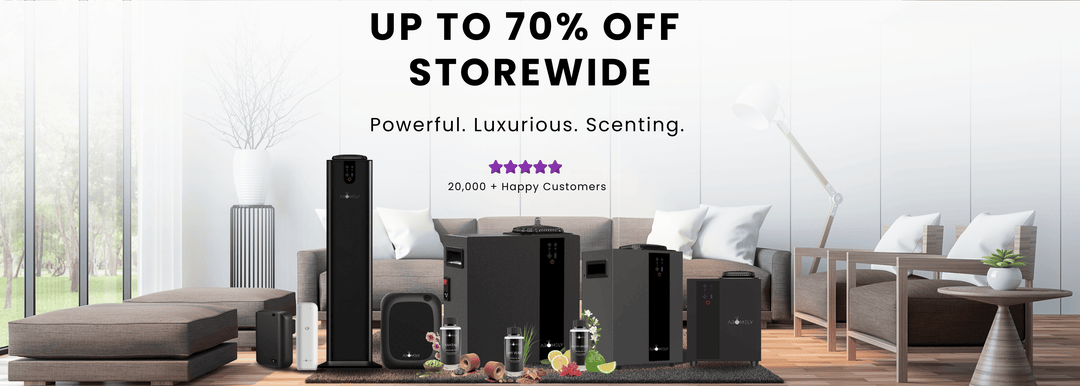 A promotional banner featuring a storewide sale of up to 70% off on luxury scent diffusers. The banner showcases various black and sleek diffuser models displayed in a modern living room setting. The text highlights "Powerful. Luxurious. Scenting." along with a 5-star rating and "20,000+ Happy Customers." The background has a minimalist aesthetic with a sofa, decorative plants, and soft lighting.