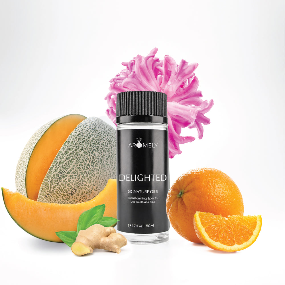 Aromely Delighted diffuser oil, 50ml, infused with melon, ginger, bright orange citrus, and pink florals. A sweet, spicy, and citrusy scent for cheerful spaces.