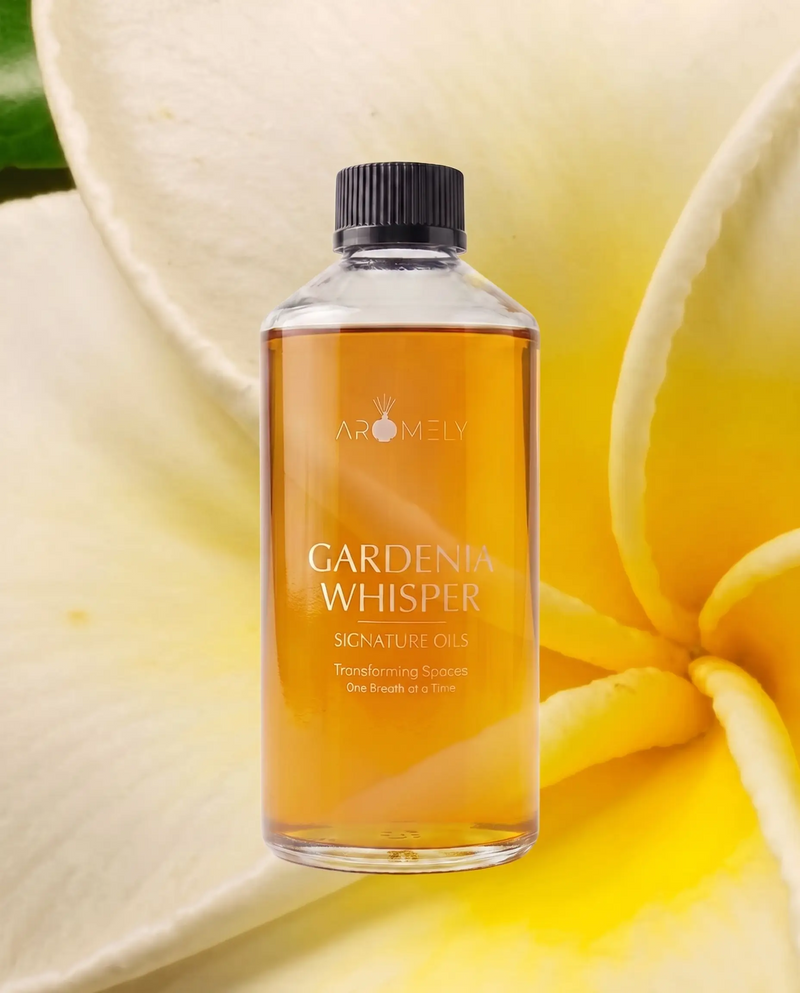 Aromely Gardenia Whisper fragrance oil bottle, 500 ml, against white and yellow petals
