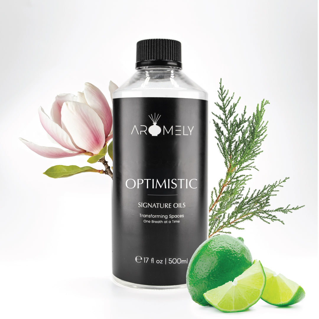 Aromely Optimistic diffuser oil, 500ml bottle, with fresh limes, magnolia flowers, and cypress leaves. A bright, uplifting citrus scent that transforms any room into an invigorating resort-like escape.