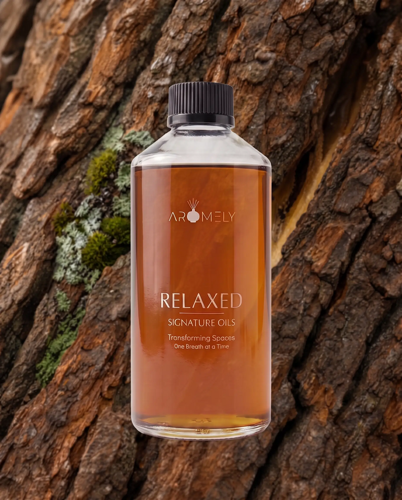 Aromely Relaxed fragrance oil bottle, 500 ml, against tree bark